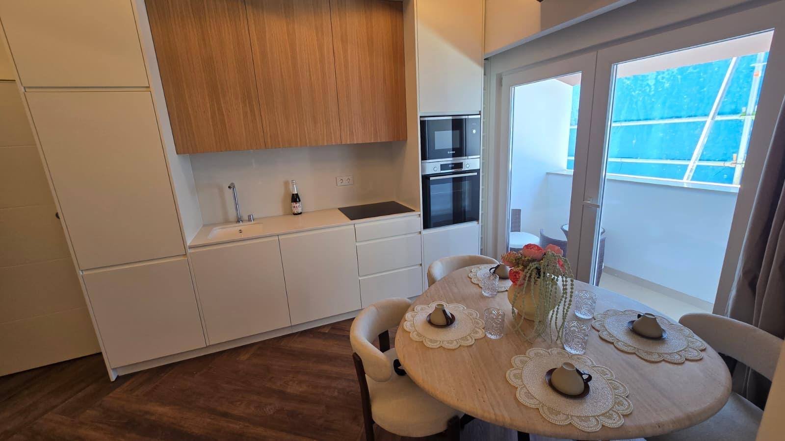 Kitchen, dining and balcony