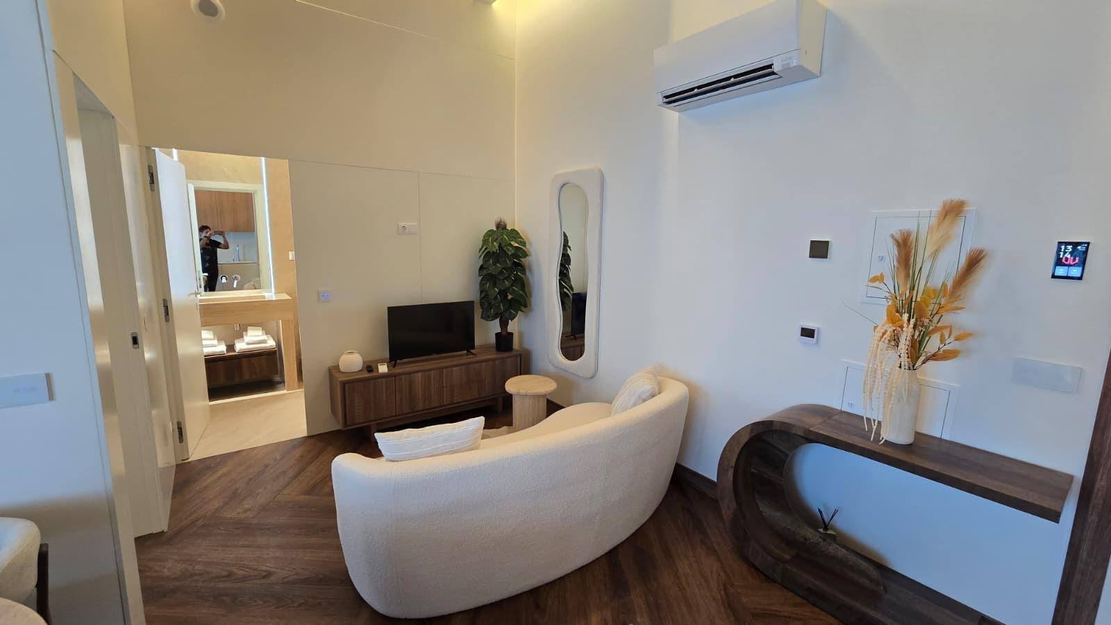 Living room, entrance and Mitsubishi A/C
