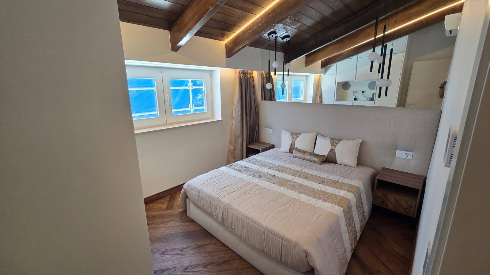 Bedroom with backlit headboard wall